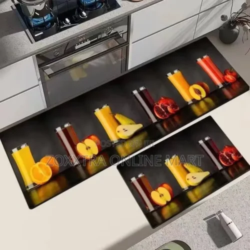 2 in 1 Polyester Absorbent Kitchen Mat20 2 in 1 Polyester Absorbent Kitchen Mat – Stylish Floor Protection for Your Kitchen 2 in 1 Polyester Absorbent Kitchen Mat is a practical and decorative floor mat set designed to make your kitchen look more attractive while helping manage everyday spills, splashes and moisture around frequently used work areas. The set comes with two matching mats – one long runner and one smaller floor mat – giving you flexible coverage for different parts of your kitchen. Place the longer mat along your cabinets, sink area or main food-preparation space, while the smaller mat can be positioned near another work area, entrance or cooking zone. Available in a wide range of colourful food, fruit, spice, vegetable, drink and decorative prints, this 2 in 1 Polyester Absorbent Kitchen Mat combines everyday functionality with a strong decorative effect. It is ideal for anyone who wants to protect high-use kitchen floor areas while adding colour and personality to the room. Why Choose the 2 in 1 Polyester Absorbent Kitchen Mat? Kitchens are among the busiest areas in the home. Water can splash from the sink, ingredients can spill during food preparation, and people may spend long periods standing around cooking and washing areas. The 2 in 1 Polyester Absorbent Kitchen Mat gives you two coordinated floor mats that can be positioned exactly where they are most useful. Instead of using one small mat that covers only a limited section, the two-piece arrangement allows you to create better coverage across separate areas of your kitchen. Two-Piece Kitchen Mat Set A major advantage of this product is the 2 in 1 design. The set includes: 1 long kitchen runner mat 1 smaller matching floor mat The long runner is suitable for positioning along kitchen cabinets, countertops or sink areas where you need extended floor coverage. The smaller mat can be used near the cooker, refrigerator, another preparation area or any other suitable part of the kitchen. Together, they help create a coordinated and organised appearance. Polyester Surface for Everyday Kitchen Use The mats are made with a polyester surface, making them suitable for everyday indoor floor use. The absorbent design helps handle minor water splashes and moisture that can occur around sinks and food-preparation areas. This can make the kitchen floor more comfortable to manage during regular cooking and cleaning routines. As with any floor mat, larger liquid spills should still be cleaned promptly rather than left on the surface for extended periods. Decorative Designs to Suit Different Kitchens One of the strongest visual features of the 2 in 1 Polyester Absorbent Kitchen Mat is the wide variety of printed designs. Available patterns shown include themes such as: Fresh fruits Vegetables Juice and drink designs Herbs and spices Cooking ingredients Kitchen utensils Food displays Geometric patterns Tropical prints Coffee and dessert themes Contemporary kitchen lettering These designs give customers more freedom to choose a mat that suits their preferred kitchen style. Whether your kitchen has white cabinets, wood finishes, grey tiles, darker flooring or modern countertops, there are several decorative options that can add contrast and character. Ideal for Sink and Food Preparation Areas The 2 in 1 Polyester Absorbent Kitchen Mat is especially useful around parts of the kitchen where people spend the most time standing. Common placement areas include: In front of the sink Along kitchen cabinets In front of preparation counters Near the cooker Beside the refrigerator At kitchen entrances Around kitchen islands Near dishwashing areas Using the mats in these high-traffic areas can help define the work zones while also improving the overall appearance of the floor. Helps Protect High-Use Floor Areas Kitchen floors can be exposed to repeated foot traffic, water droplets, crumbs and minor food spills. Placing a mat over frequently used sections creates an additional surface between everyday kitchen activity and the floor itself. The 2 in 1 Polyester Absorbent Kitchen Mat is particularly useful for tiled kitchens, where a decorative runner can also soften the appearance of large open floor areas. It can also help prevent certain sections of the floor from looking bare or unfinished. A Simple Way to Refresh Your Kitchen Décor You do not need to replace cabinets, tiles or appliances to give your kitchen a new look. Adding a colourful kitchen mat set can instantly change the appearance of the room. The bold printed designs available with this set create a visual focal point on the floor and can help bring together other colours already present in the kitchen. For renters or anyone who does not want to make permanent decorating changes, floor mats are an easy way to personalise the space. Suitable for Different Kitchen Layouts Because the set includes both a long and short mat, it works with different kitchen arrangements. It can be used in: Straight-line kitchens L-shaped kitchens U-shaped kitchens Small apartment kitchens Open-plan kitchens Kitchenettes Family kitchens Short-let apartments Guest houses For an L-shaped kitchen, for example, the long mat can run along one section while the smaller mat covers another important work area. Practical for Homes and Short-Let Apartments The 2 in 1 Polyester Absorbent Kitchen Mat is also a useful addition to furnished rental properties and short-let apartments. A decorative mat can make a kitchen look more complete and visually appealing in listing photos while also serving an everyday practical purpose for guests. Landlords and property managers can use matching floor mats to give the kitchen a more coordinated and welcoming finish without major renovation. Easy Decorative Upgrade One of the most appealing things about this kitchen mat set is how quickly it can change a room. Simply position the larger runner and smaller mat in the desired areas to add: Colour Pattern Visual warmth Defined floor zones A more finished appearance The mats can also be changed later if you want to refresh your kitchen style again. Key Features 2-piece kitchen floor mat set Includes one long runner and one smaller mat Polyester surface Absorbent design for everyday moisture Suitable for kitchen floor use Ideal for sink and preparation areas Helps protect high-traffic floor sections Available in multiple decorative prints Fruit, spice, vegetable and food-themed designs Suitable for modern and traditional kitchens Useful for homes and apartments Suitable for short-let and rental properties Decorative and practical kitchen accessory Can be positioned in different kitchen zones Easy way to refresh kitchen décor Who Should Buy the 2 in 1 Polyester Absorbent Kitchen Mat? This product is suitable for homeowners, tenants, families, landlords, short-let operators and anyone who wants a more attractive and practical kitchen floor setup. It is particularly useful if you want a kitchen mat set in Nigeria that gives you two coordinated pieces instead of just one mat. The long runner provides extended coverage, while the smaller mat gives you flexibility to cover another work area. Buy 2 in 1 Polyester Absorbent Kitchen Mat Online in Nigeria Improve the look and functionality of your kitchen with the 2 in 1 Polyester Absorbent Kitchen Mat. With one long runner, one smaller matching mat and a wide range of colourful decorative patterns, this set gives you an easy way to brighten your kitchen while covering busy floor areas around your sink, countertop and cooking space. Choose a design that suits your kitchen and enjoy the convenience of having two coordinated mats in one set. Order your 2 in 1 Polyester Absorbent Kitchen Mat from Zoxxtra Online Mart today and give your kitchen floor a more stylish and practical finish.