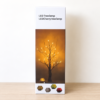 LED Birch-Cherry Tree Lamp glowing on side table LED Birch-Cherry Tree Lamp glowing on side table