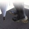 Heavy-Duty Honeycomb Dirt Trapper Doormat.3 Honeycomb dirt trapper doormat with muddy boots