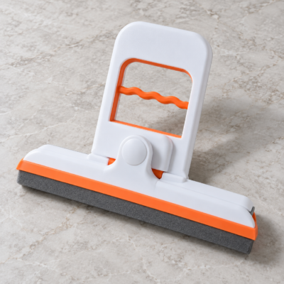 White and orange folding sponge mop-1 Compact white and orange mini sponge mop with folding squeeze handle